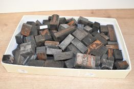A selection of early to mid 20th-century Industrial-style wooden letter printing blocks, to