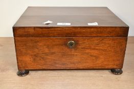 A 19th-century mahogany jewellery box, featuring internal compartments, twin loop-formed handles,