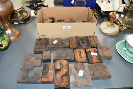 A selection of early to mid 20th-century Industrial-style wooden letter printing blocks, to