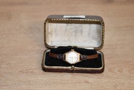 A lady's vintage 9ct gold wrist watch by Trebex having an Arabic numeral and baton dial with