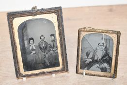Two small 19th-century presumed ambrotype photographs, to feature a group portrait and an individual
