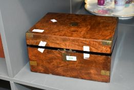 A Victorian brass-bound burr walnut writing slope, featuring an internal slope and compartments,