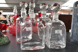 Four vintage Dartington Crystal after Frank Thrower-style square decanters, featuring clear heavy