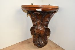 A fine late 19th-century carved mahogany game bird wall bracket, featuring a detailed pheasant or
