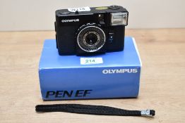 An Olympus Pen EF 35mm compact film camera, with case, box and wrist strap.