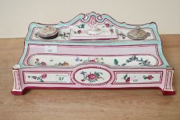 A 19th-century French Louis XVI-style GIEN faience écritoire, featuring a double inkwell and pen