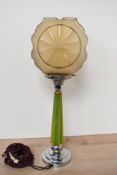 An early 20th-century Art Deco table lamp, having a green bakelite stem and a similar glass shade,