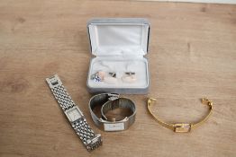 A boxed pair of agate set cufflinks and tie pin, along with three wristwatches comprising Bering,