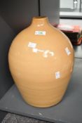 A large vintage Parlane decorative pottery floor vase, having a soft mustard yellow glaze, marked to