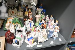A selection of late 19th to 20th-century ceramic and porcelain decorative figures, to feature