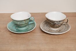 Two late 20th-century French Niderviller studio pottery cup and saucer sets, to feature 'Mousse' and