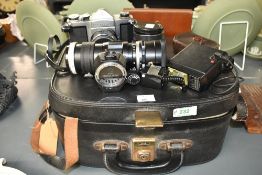 A Pentax S1a camera with Super-Takumar 1:2/55 lens, a Hanimex Tele-lens 1:4,5 200mm lens and a