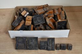 A selection of early to mid 20th-century Industrial-style wooden letter printing blocks, to