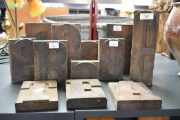 A selection of early to mid 20th-century Industrial-style wooden letter printing blocks, to