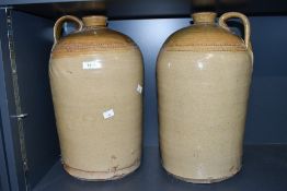 Two large late 19th to early 20th-century stoneware flagons, featuring a natural salt glaze finish