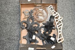 Three early to mid 20th-century Medieval-style wrought iron wall sconces, featuring scrolled fleur-