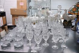 A selection of 20th-century crystal cut glassware, to feature three decanters of varying sizes, a