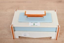 An unusual early 20th-century Art Deco bakelite desk caddy, featuring cream, light blue and orange