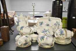 A vintage Royal Albert bone china 'Forget Me Not' tea and coffee service, featuring delicate blue