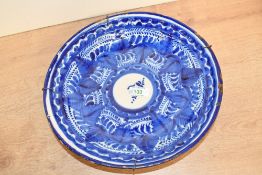 A 19th-century Spanish Manises-style ceramic plate, featuring hand painted blue and white floral and