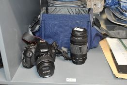 A Canon EOS 2000D camera with Canon Zoom lens EF-S 18-55mm 1;3,5 and a Canon Zoom lens EF 75-300mm