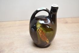 A vintage American art pottery Rockwood-style jug, featuring a hand painted corn stalk motif,