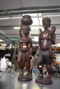 Two 20th-century African Art hand carved hard wood sculptural figures, to feature a stylised