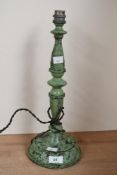A early 20th-century bakelite lamp base, having speckled green paint decoration, unmarked, 38cm in