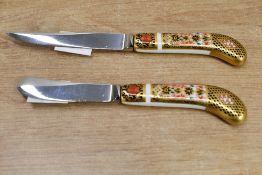 Two 20th-century Royal Crown Derby 'Old Imari' porcelain-handled knives, to feature a butter knife