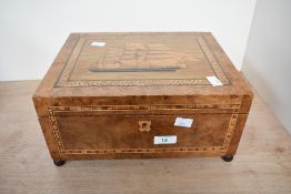 A 19th-century marquetry-inlaid sewing box, featuring a three-masted sailing ship framed by