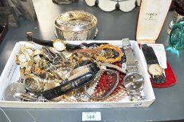 An assortment of costume jewellery, including faux pearls, wristwatches and statement pieces