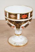 A 20th-century Royal Crown Derby bone china 'Old Imari' (1128) goblet, featuring cobalt blue, iron-