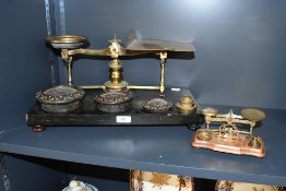 A large 19th-century brass counter-top postal scales, having both cast iron and brass graduated