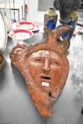 A large contemporary Folk Art-style carved burl wood root tree spirit decoration, featuring two
