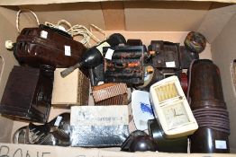 A selection of early 20th-century bakelite wares, to feature small desk clocks, a hand held light,