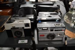Five Instamatic Cameras. A Kodak Instamatic 50, a Kodak Instamatic 100, a Kodak Instamatic 155X, a
