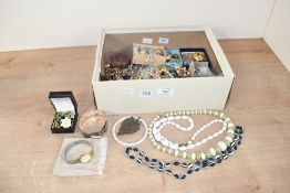 A large collection of costume jewellery, including faux pearls, brooches, a rose quartz bracelet and