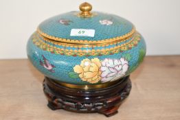 A 20th-century Chinese cloisonné lidded box, featuring intricate scrolled floral and avian
