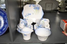 A early 20th-century Shelley fine bone china 'Blue Iris' part tea set, featuring hand painted blue