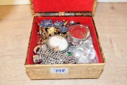 A faux leather Egyptian style jewellery box, containing a small collection of costume jewellery,