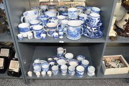 A large quantity of 19th to 20th-century blue and white transferware cups, mugs, moustache cups