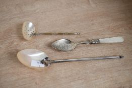 Three Victorian mother-of-pearl and white metal metal spoons, to include a pierced serving spoon and