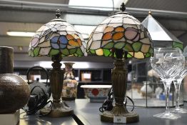 Two vintage Loxton Lighting Limited Tiffany-style table lamps, featuring colourful floral and