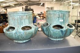 Two large contemporary studio pottery strawberry planters, featuring a textured turquoise and