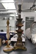 A tall vintage Victorian-style resin and hard stone table lamp base; sold with a smaller green