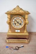 A late 19th to early 20th-century French ormolu-style mantel clock, featuring an Empire-style