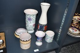 A selection of mid to late 20th-century Poole pottery, to feature a floral vase and bud vase painted