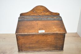 A late 19th to early 20th-century oak ecclesiastical offertory box, fitted with leather and brass