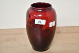 A vintage Royal Doulton flambé bud vase, featuring rural scenes of cattle, marked to base and scored