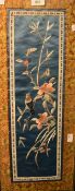 A 20th Century Chinese embroidery on silk, depicting a small bird and butterflies upon a flowering